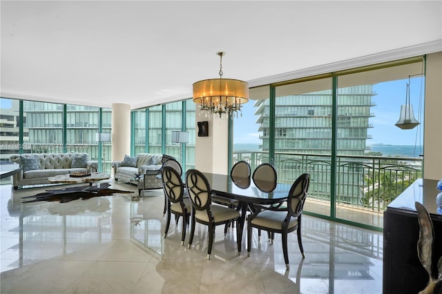 dining room featuring plenty of natural light, an inviting chandelier, and a wall of windows