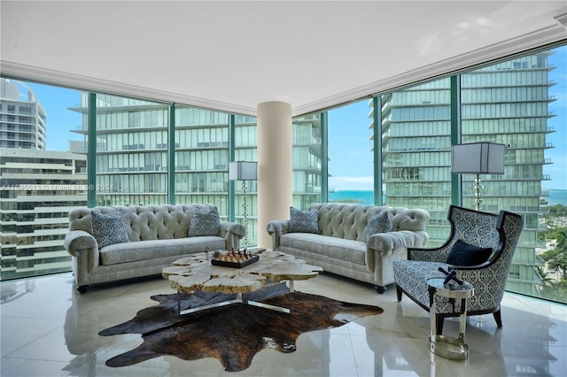 living room featuring light tile patterned floors, a wall of windows, and a wealth of natural light