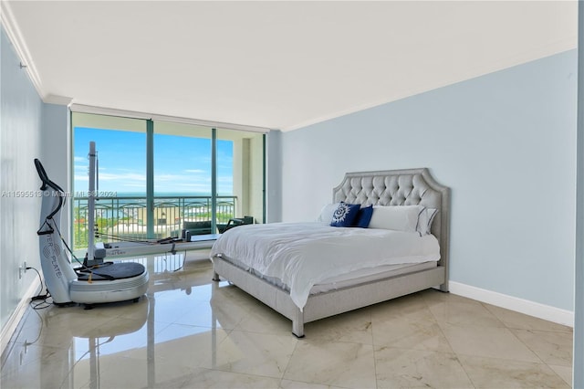 bedroom featuring crown molding and a wall of windows