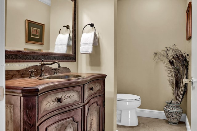 bathroom with tile patterned floors, vanity, and toilet