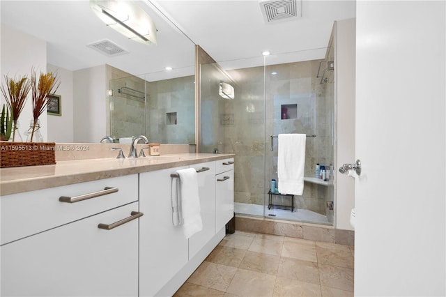 bathroom featuring tile patterned floors, vanity, toilet, and an enclosed shower