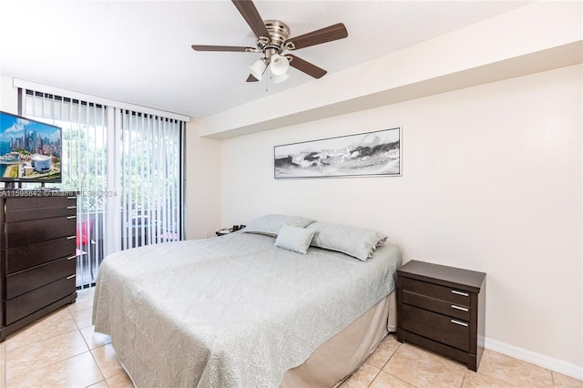 bedroom featuring ceiling fan, light tile floors, and access to outside