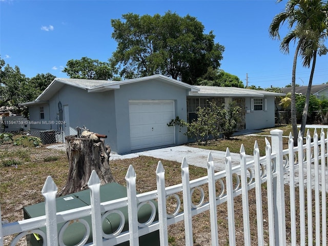 single story home with a garage