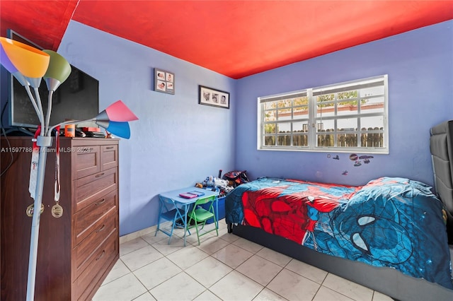 bedroom featuring tile floors