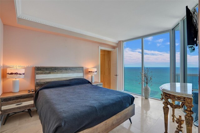 bedroom featuring a water view, floor to ceiling windows, access to outside, and ornamental molding