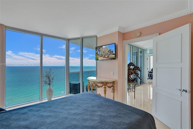 bedroom featuring crown molding, access to outside, and floor to ceiling windows