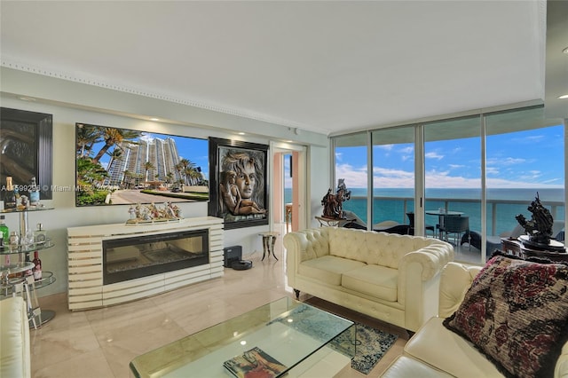 living room with expansive windows and a water view