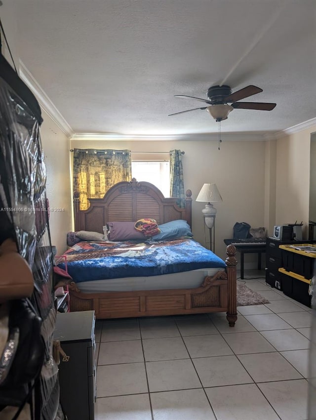 bedroom with tile flooring, ceiling fan, a textured ceiling, and crown molding