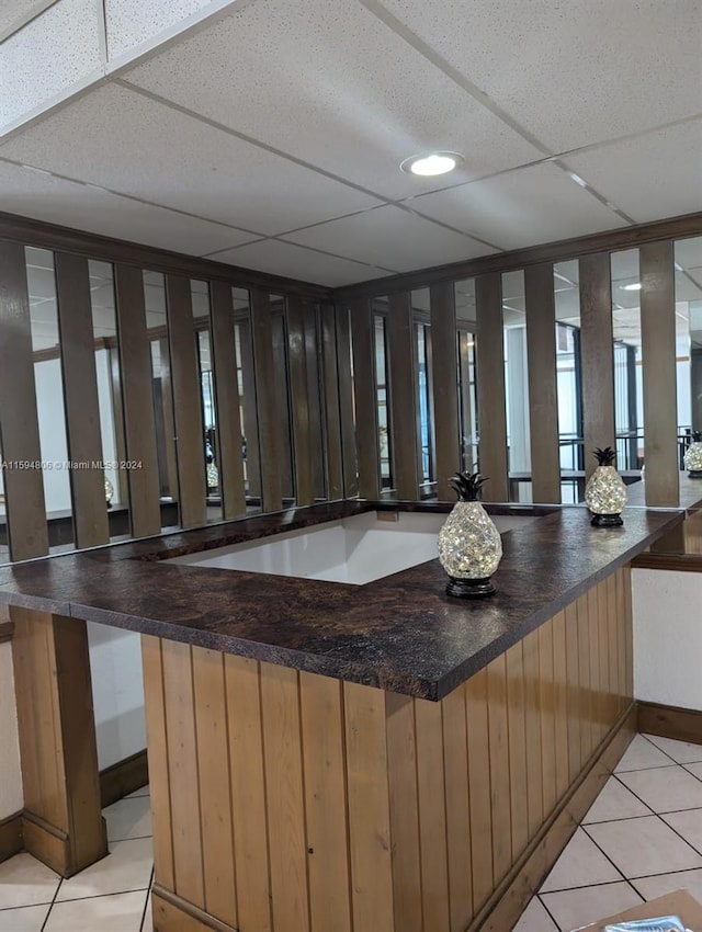 bar area with light tile patterned floors and recessed lighting