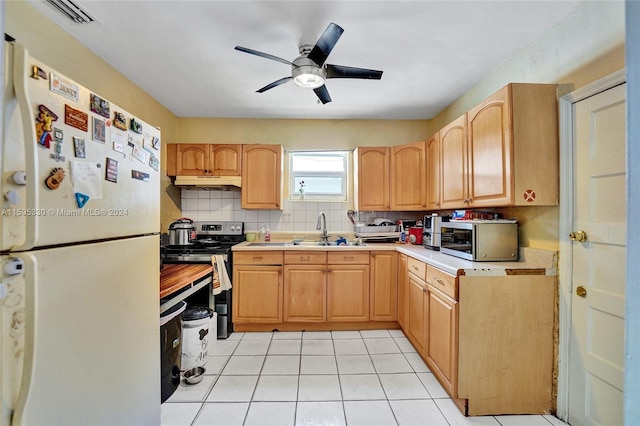 kitchen with light tile patterned flooring, sink, backsplash, ceiling fan, and stainless steel appliances