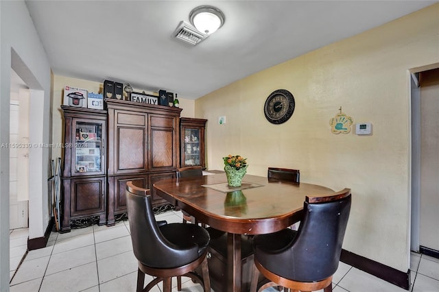 dining space with light tile patterned floors