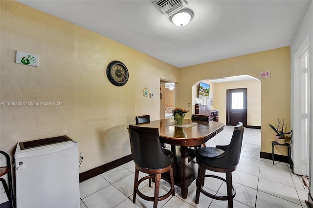 dining area featuring light tile patterned floors