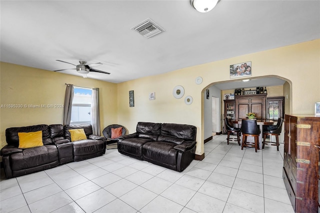 living room featuring light tile patterned floors and ceiling fan