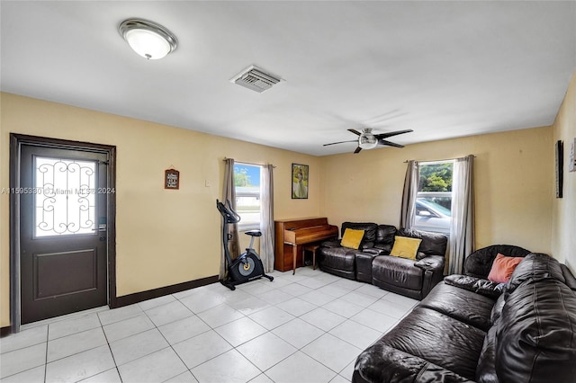 living room featuring light tile patterned floors and ceiling fan