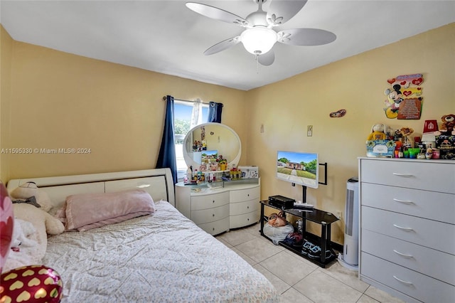 bedroom with ceiling fan and light tile patterned flooring