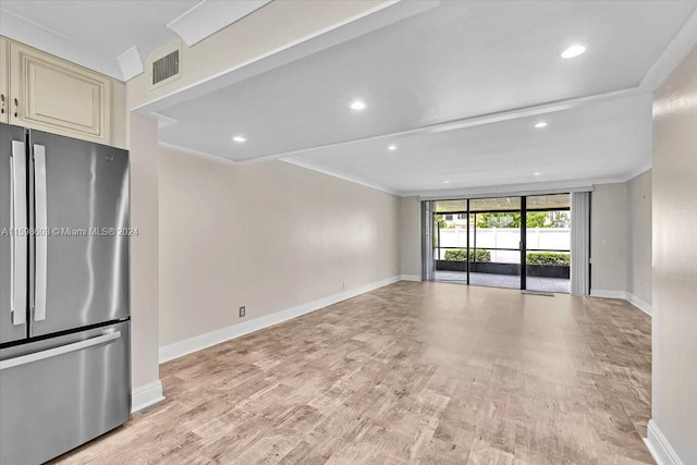 interior space featuring light hardwood / wood-style flooring, expansive windows, and crown molding