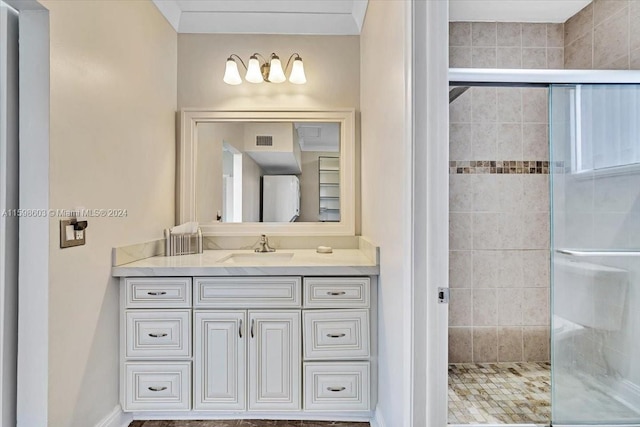 bathroom featuring vanity and a shower with shower door