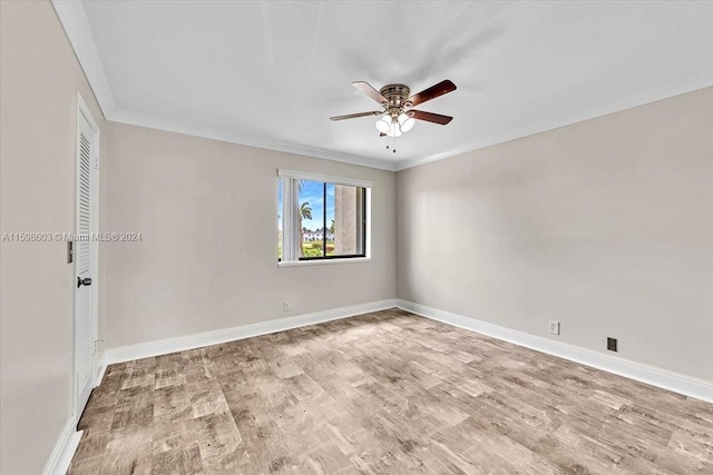 unfurnished room featuring light wood-type flooring, ceiling fan, and ornamental molding