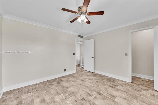 empty room with light wood-type flooring, ceiling fan, and crown molding