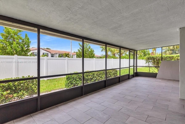 unfurnished sunroom with a healthy amount of sunlight