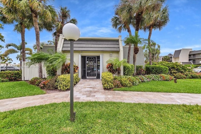 view of front of property with a front lawn