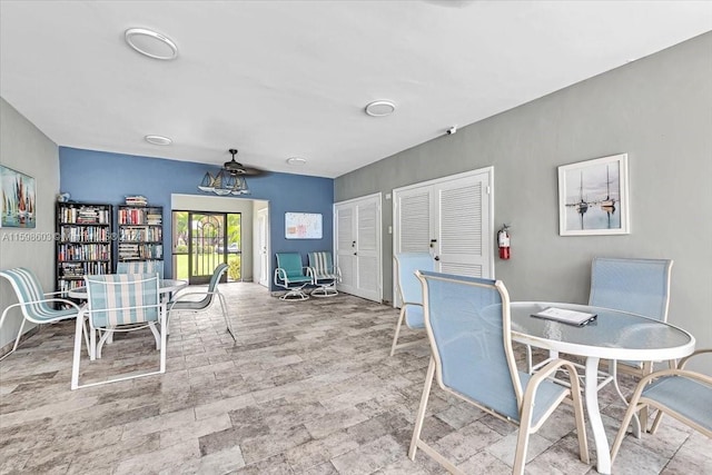 dining space featuring ceiling fan