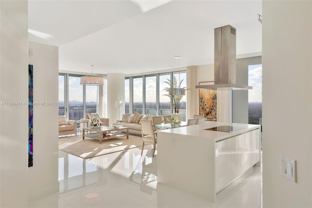 tiled living room featuring expansive windows