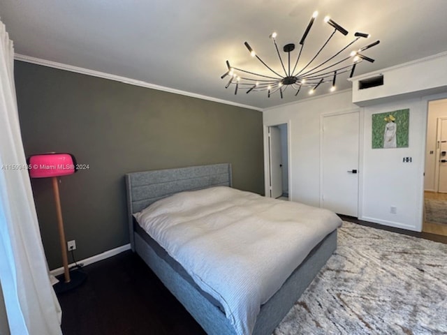 bedroom with crown molding and an inviting chandelier