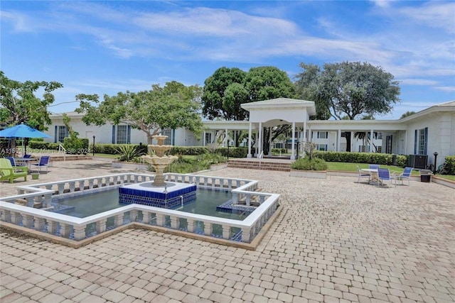 view of swimming pool with a patio