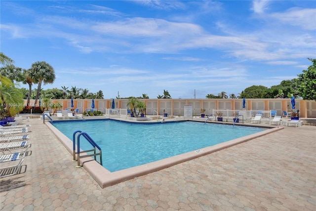 view of swimming pool featuring a patio