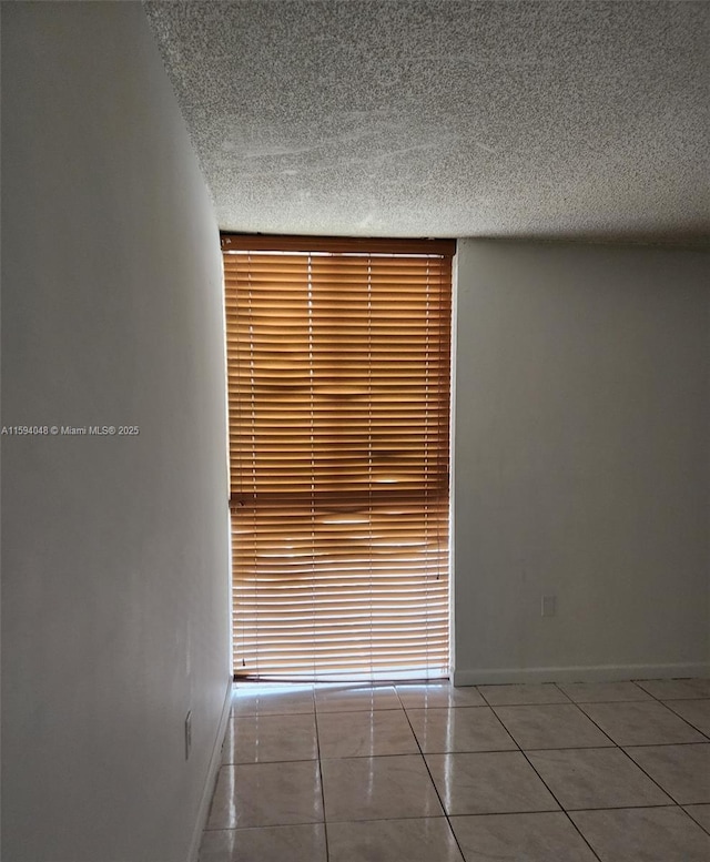 interior details featuring a textured ceiling