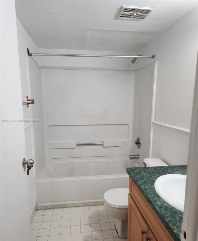 full bathroom featuring tub / shower combination, tile patterned floors, vanity, and toilet