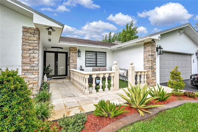 entrance to property featuring a garage