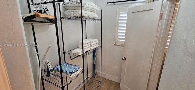 interior space with a barn door and hardwood / wood-style floors