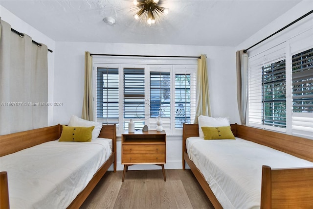 bedroom with light wood-type flooring