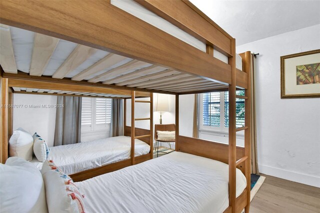 bedroom with hardwood / wood-style floors