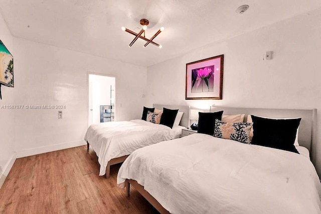 bedroom with hardwood / wood-style flooring