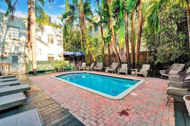 view of pool featuring a patio area