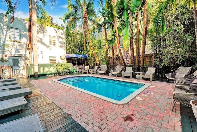 view of swimming pool with a patio area and area for grilling