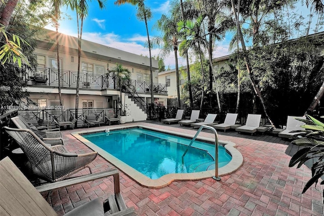 view of swimming pool with a patio area