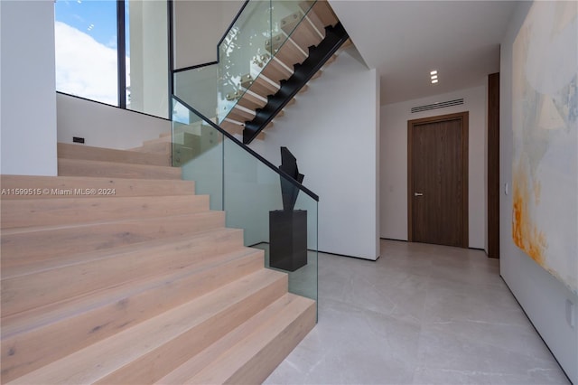 stairway with concrete floors