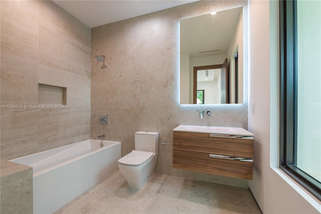 full bathroom featuring shower / tub combination, vanity, tile walls, and toilet