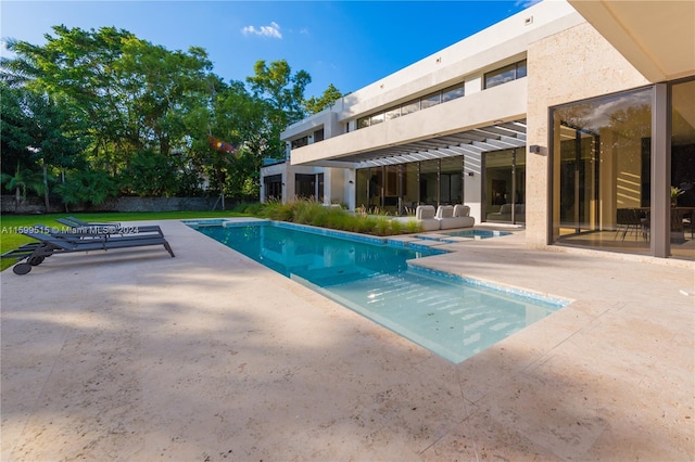 view of swimming pool featuring a patio area