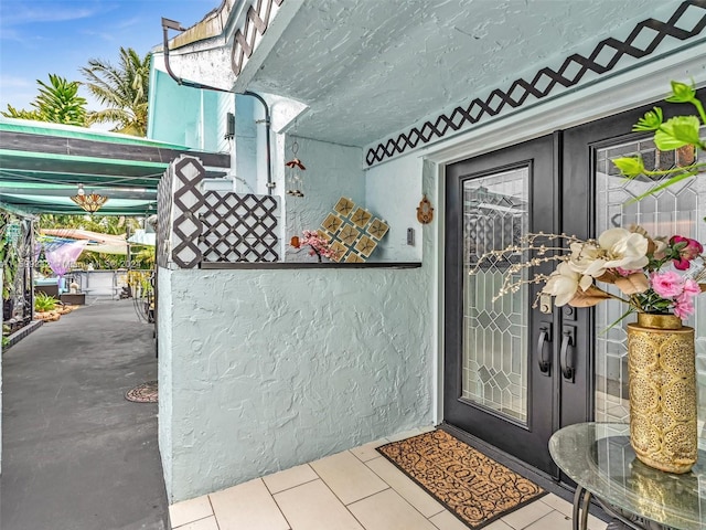 view of exterior entry featuring french doors