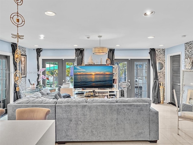 living room featuring french doors, plenty of natural light, and light tile patterned flooring