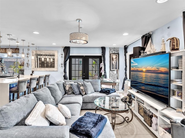 living room with french doors and light tile patterned floors