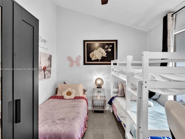 bedroom featuring tile patterned floors, ceiling fan, and vaulted ceiling