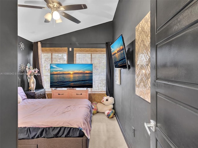 bedroom featuring ceiling fan and lofted ceiling