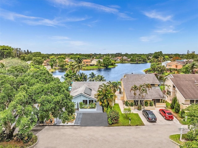 birds eye view of property with a water view