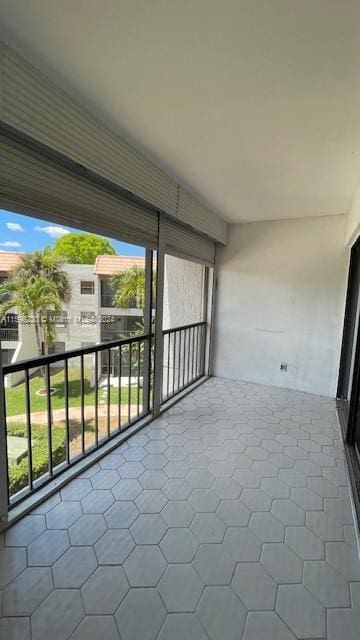 unfurnished sunroom with plenty of natural light